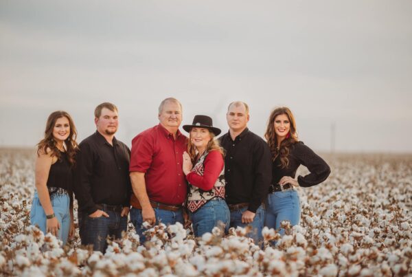 Lloyd Arthur and family in cotton field